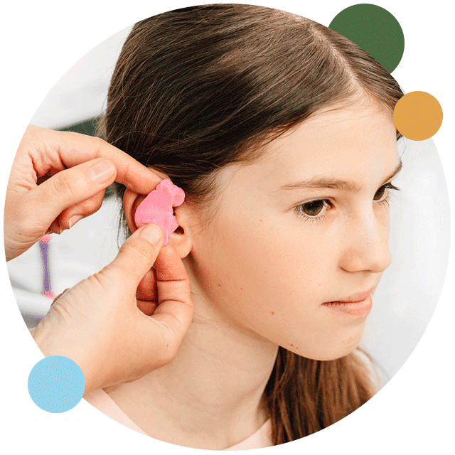 Young girl getting custom ear molds to protect her ears and manage hearing loss