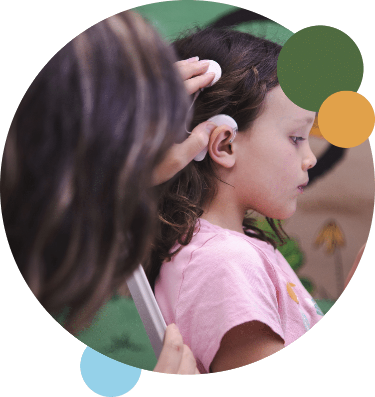 Kid with cochlear hearing aids